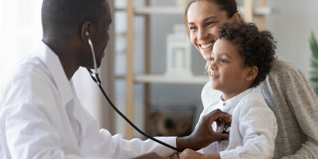 pediatrician hold stethoscope exam child boy patient