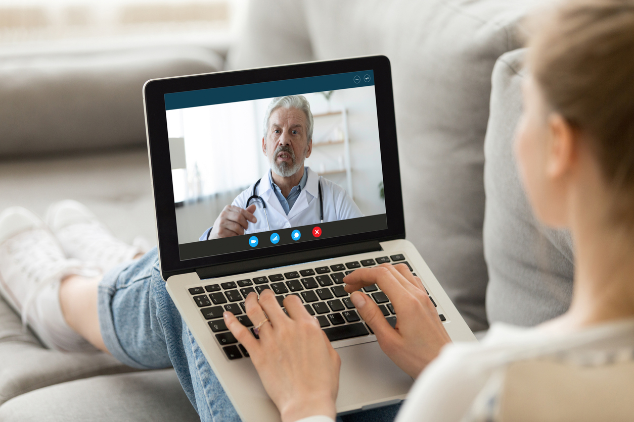 patient having virtual appointment with doctor over video