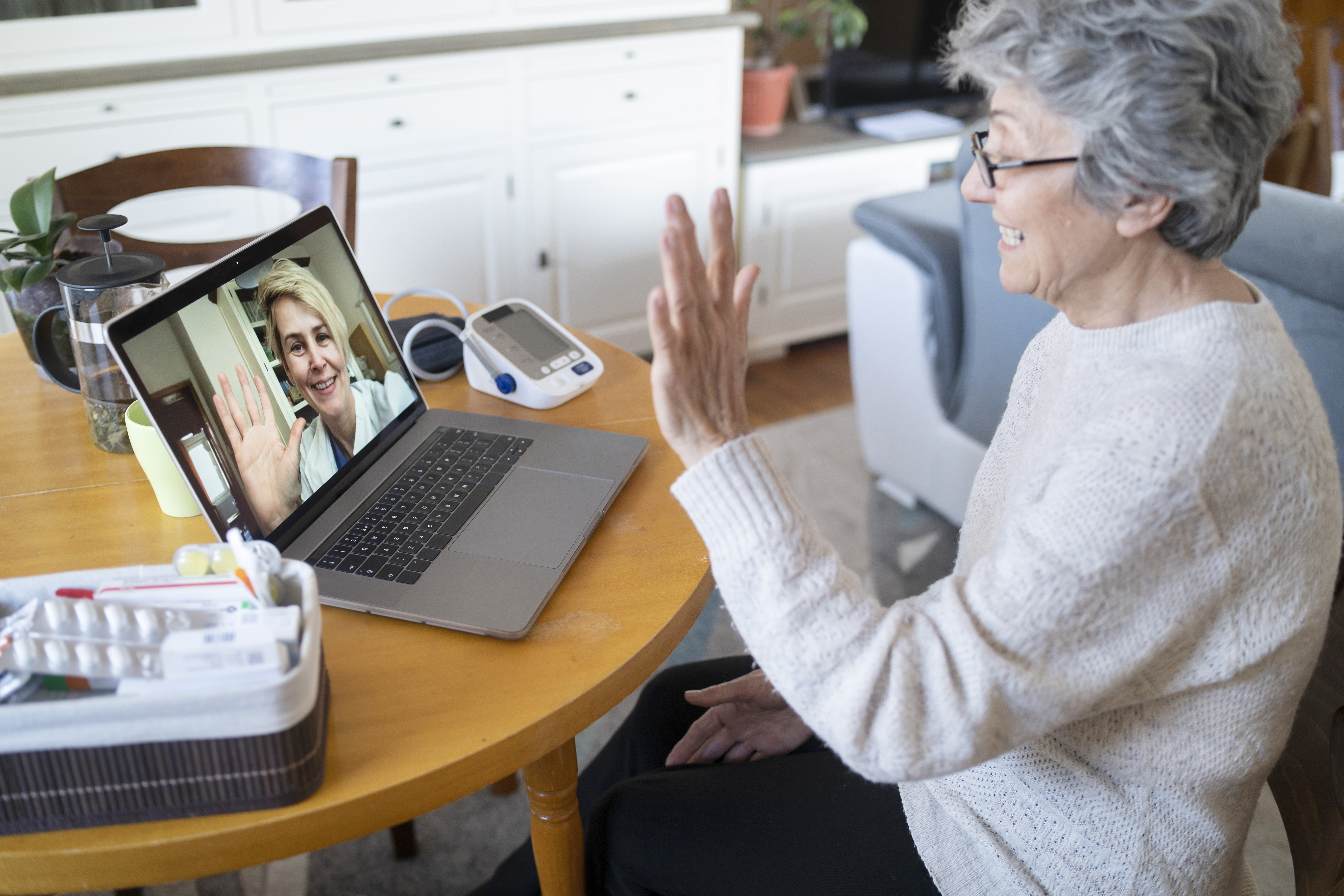 Elderly woman having an online consultation with a doctor 