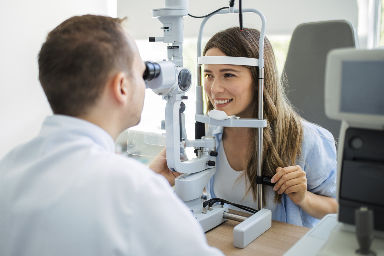 Doctor checking eye vision of patient