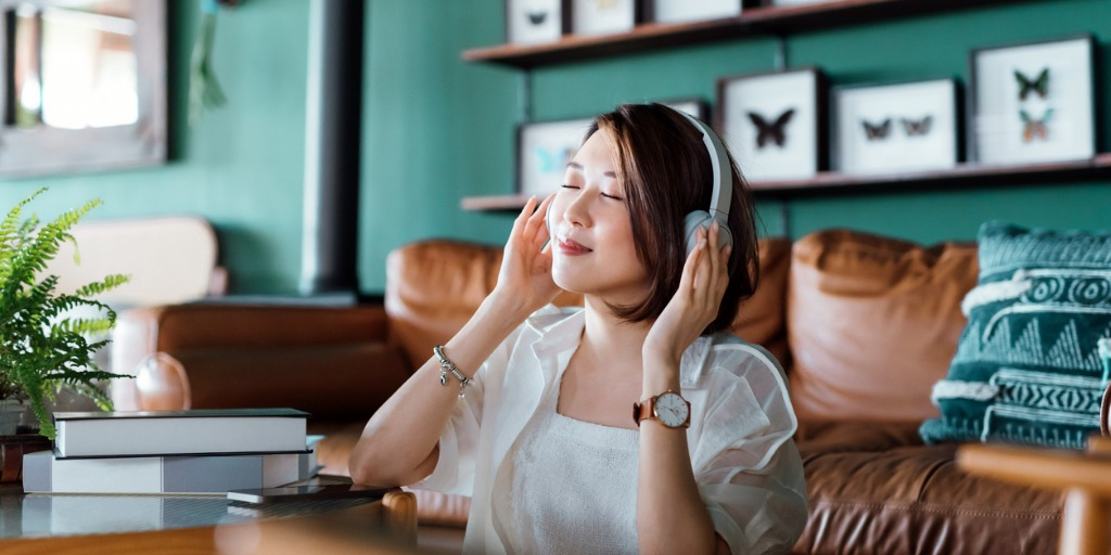 relaxed-woman-with-eyes-closed-enjoying-music