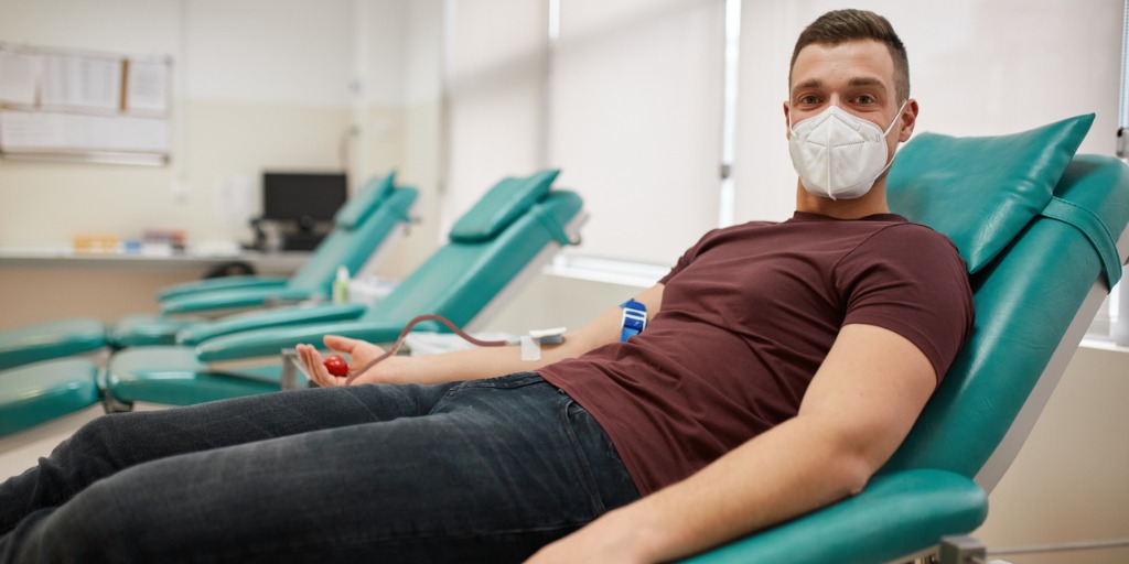 Young Male Donor Donating Blood During Coronavirus Pandemic